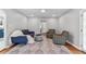 Open-concept living room with a sofa, chairs, and hardwood floors at 1046 Yale N St, St Petersburg, FL 33713