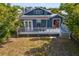 This backyard features a spacious wooden deck, perfect for outdoor relaxation and entertainment at 107 W Amelia Ave, Tampa, FL 33602