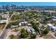 Real estate showcasing cozy neighborhood living, featuring mature trees and alley access, conveniently located downtown at 107 W Amelia Ave, Tampa, FL 33602