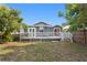 Home features a spacious backyard and a large wooden deck, perfect for outdoor living at 107 W Amelia Ave, Tampa, FL 33602