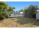 Home with spacious backyard and large wooden deck, perfect for outdoor living and entertaining at 107 W Amelia Ave, Tampa, FL 33602