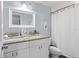 Bathroom features a granite counter, dual sinks, and modern fixtures at 107 W Amelia Ave, Tampa, FL 33602