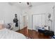 Bedroom boasts pristine hardwood floors, closet, and convenient access to the hallway at 107 W Amelia Ave, Tampa, FL 33602