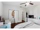 Bright bedroom boasts hardwood floors, closet, desk, and TV at 107 W Amelia Ave, Tampa, FL 33602