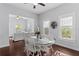Bright dining room featuring natural light, hardwood floors and open floor plan view of the living room at 107 W Amelia Ave, Tampa, FL 33602