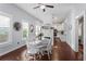Bright dining room with hardwood floors, large windows and stylish kitchen view at 107 W Amelia Ave, Tampa, FL 33602