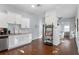 Spacious kitchen with white cabinets, granite countertops, and views into dining area at 107 W Amelia Ave, Tampa, FL 33602