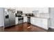 Modern kitchen featuring white cabinets, stainless steel appliances, and granite countertops at 107 W Amelia Ave, Tampa, FL 33602