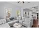 Bright and airy living room featuring a comfortable sectional sofa with great natural light and modern decor at 107 W Amelia Ave, Tampa, FL 33602