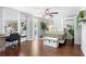 Bright and airy bedroom with wood floors, desk, and outdoor patio access at 107 W Amelia Ave, Tampa, FL 33602