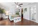 Tranquil primary bedroom featuring modern ceiling fan and views to the closet at 107 W Amelia Ave, Tampa, FL 33602