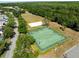 Drone shot of community basketball and volleyball courts, showing street and parking at 11503 Whispering Hollow Dr, Tampa, FL 33635