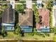 Aerial view of charming homes featuring private pools, lush landscaping, and well-maintained properties at 11503 Whispering Hollow Dr, Tampa, FL 33635