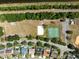 Aerial view featuring a community field, basketball court, and well-kept homes in a serene neighborhood at 11503 Whispering Hollow Dr, Tampa, FL 33635