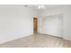 An empty bedroom featuring light wood flooring, a ceiling fan and a closet at 11503 Whispering Hollow Dr, Tampa, FL 33635