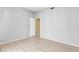 Empty bedroom features laminate flooring, a ceiling fan, and a closet at 11503 Whispering Hollow Dr, Tampa, FL 33635