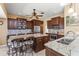 Spacious kitchen with granite countertops, custom cabinets, stainless steel appliances, and an island with seating at 11503 Whispering Hollow Dr, Tampa, FL 33635