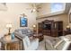 Comfortable living room with tile floors, high ceilings, ceiling fan, and neutral colors at 11503 Whispering Hollow Dr, Tampa, FL 33635