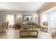Sophisticated living room featuring plush sofa, decorative mirrors, and elegant furnishings at 11503 Whispering Hollow Dr, Tampa, FL 33635