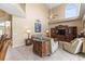 Spacious living room features tile floors, high ceilings, and a view of the second story at 11503 Whispering Hollow Dr, Tampa, FL 33635