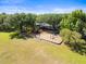 Aerial shot of a colorful playground with swings and slides set in a park-like setting for community fun at 11503 Whispering Hollow Dr, Tampa, FL 33635