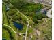 Aerial view of home located within a community and near winding walking trails and ponds at 12026 Medley Ter, Lakewood Ranch, FL 34211