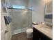 Bright bathroom featuring a walk-in glass shower and granite countertop sink at 12026 Medley Ter, Lakewood Ranch, FL 34211