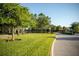 Community entrance with lush landscaping and Arbor Grande signage at 12026 Medley Ter, Lakewood Ranch, FL 34211