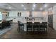 Well-lit kitchen featuring stainless steel appliances, an island with barstool seating, and ample cabinet space at 12026 Medley Ter, Lakewood Ranch, FL 34211