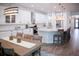 Bright kitchen with stainless steel appliances, large island, and modern fixtures at 12026 Medley Ter, Lakewood Ranch, FL 34211
