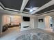 Spacious main bedroom featuring a decorative ceiling and a view of the living room at 12026 Medley Ter, Lakewood Ranch, FL 34211
