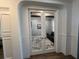 An office with a sitting area viewed through glass panel french doors at 12026 Medley Ter, Lakewood Ranch, FL 34211