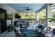 Inviting outdoor living area featuring a kitchen, comfortable seating, and an entertainment center at 12026 Medley Ter, Lakewood Ranch, FL 34211