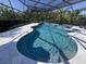 A large swimming pool featuring a screened enclosure, spa, and elegant water features at 12026 Medley Ter, Lakewood Ranch, FL 34211