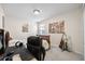 Cozy bedroom featuring a full-size bed, large window, and stylish decor at 1227 Ballard Green Pl, Brandon, FL 33511