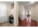 Inviting entryway with tile flooring, wood stairs and trim, storage closet, and views into adjacent living spaces at 1227 Ballard Green Pl, Brandon, FL 33511