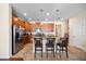 Bright eat-in kitchen with granite countertops, stainless steel appliances, a central island with seating, and tile flooring at 1227 Ballard Green Pl, Brandon, FL 33511