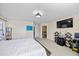 Spacious main bedroom with white walls, large bed, and an ensuite bathroom at 1227 Ballard Green Pl, Brandon, FL 33511