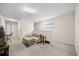 Neutral sitting area with carpet, sofa, and small table at 1227 Ballard Green Pl, Brandon, FL 33511