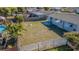 This back yard is enclosed by fencing and has a patio with above ground pool at 1264 Chelsea Ln, Holiday, FL 34691