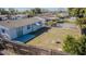 Spacious backyard featuring a lawn area, patio, and fenced perimeter at 1264 Chelsea Ln, Holiday, FL 34691