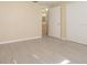 This bedroom has light, neutral walls and light wood look floors at 1264 Chelsea Ln, Holiday, FL 34691