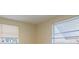 This bedroom has neutral walls and two window letting in natural light at 1264 Chelsea Ln, Holiday, FL 34691