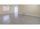 Spacious living room boasts tile floors, neutral paint, ceiling fan, sliding door and window for natural light at 1264 Chelsea Ln, Holiday, FL 34691