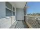 A cozy screened-in porch with lattice and view of the neighborhood at 1264 Chelsea Ln, Holiday, FL 34691