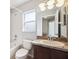 Bathroom featuring a vanity with an oval sink, and a tiled shower-tub combo at 12719 Saulston Pl, Hudson, FL 34669