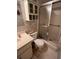 Cozy bathroom with white cabinets, toilet, and a glass enclosed shower at 12920 Wedgewood Way # A, Hudson, FL 34667