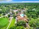 Aerial view of the community clubhouse, pool, tennis courts, and public golf course at 12920 Wedgewood Way # A, Hudson, FL 34667
