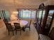 Traditional dining room features a chandelier, china cabinet and six-chair dining set at 12920 Wedgewood Way # A, Hudson, FL 34667