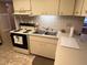 Well-equipped kitchen featuring stainless steel sink and modern appliances at 12920 Wedgewood Way # A, Hudson, FL 34667